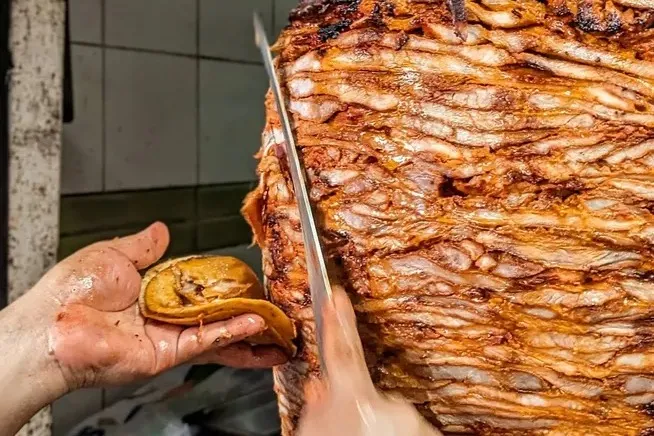 slicing pastor meat